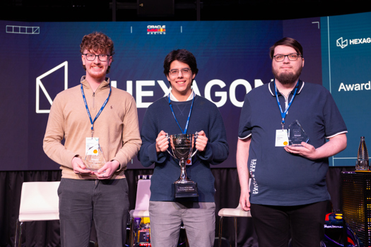 Winner of the Future Skills challenge Antonio Masuda (centre), with the two runners-up, Kyle Tunstall (left) and Sebastian Kowalke (right)