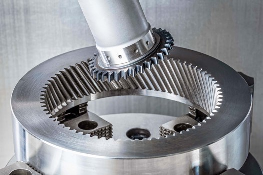 Solid or interchangeable-insert carbide tool systems for gear skiving can be repeatedly reground