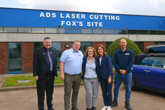 (L-R) Stuart Rowan, Duncan Keates, Angie Keates, Liz Kendall MP and Zeke Keates at ADS Laser's facility 